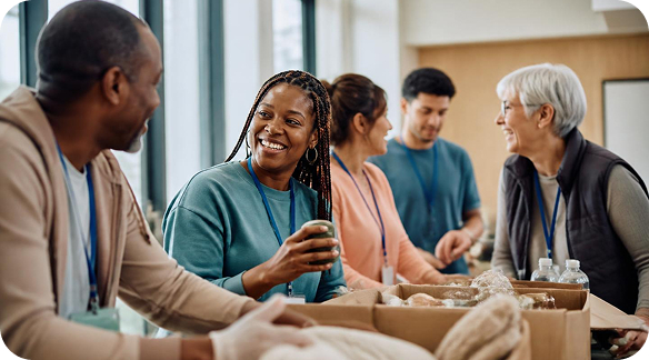 Image (Community volunteers working together in a bright community hall)